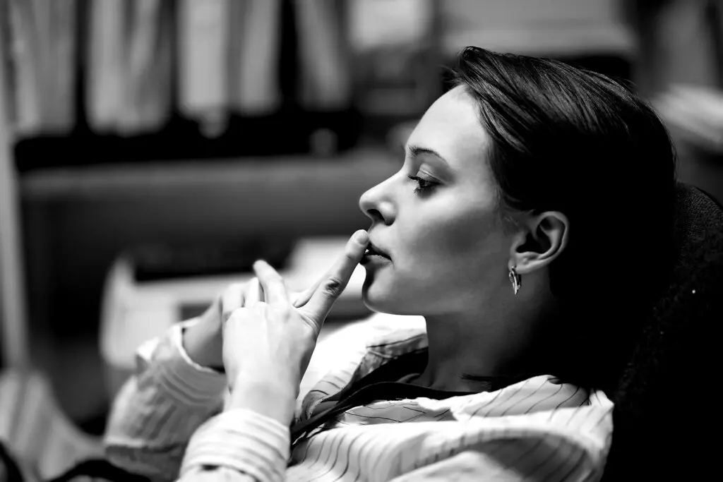 Office worker taking a seated break in a workplace setting